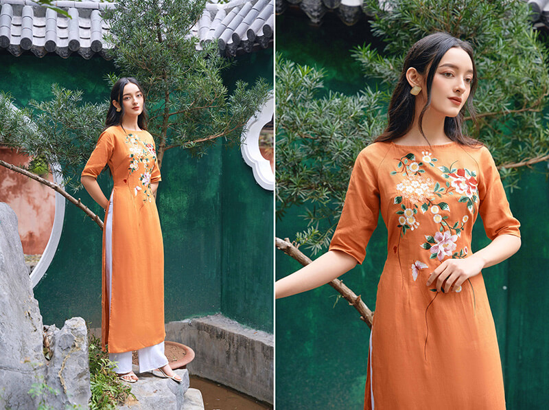 Áo dài màu cam cùng hoa tiết floral tạo điểm nhấn thu hút